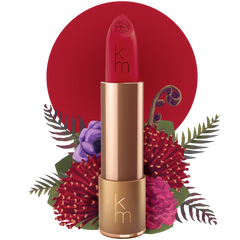 Red lipstick with gold cap on a white background with floral elements