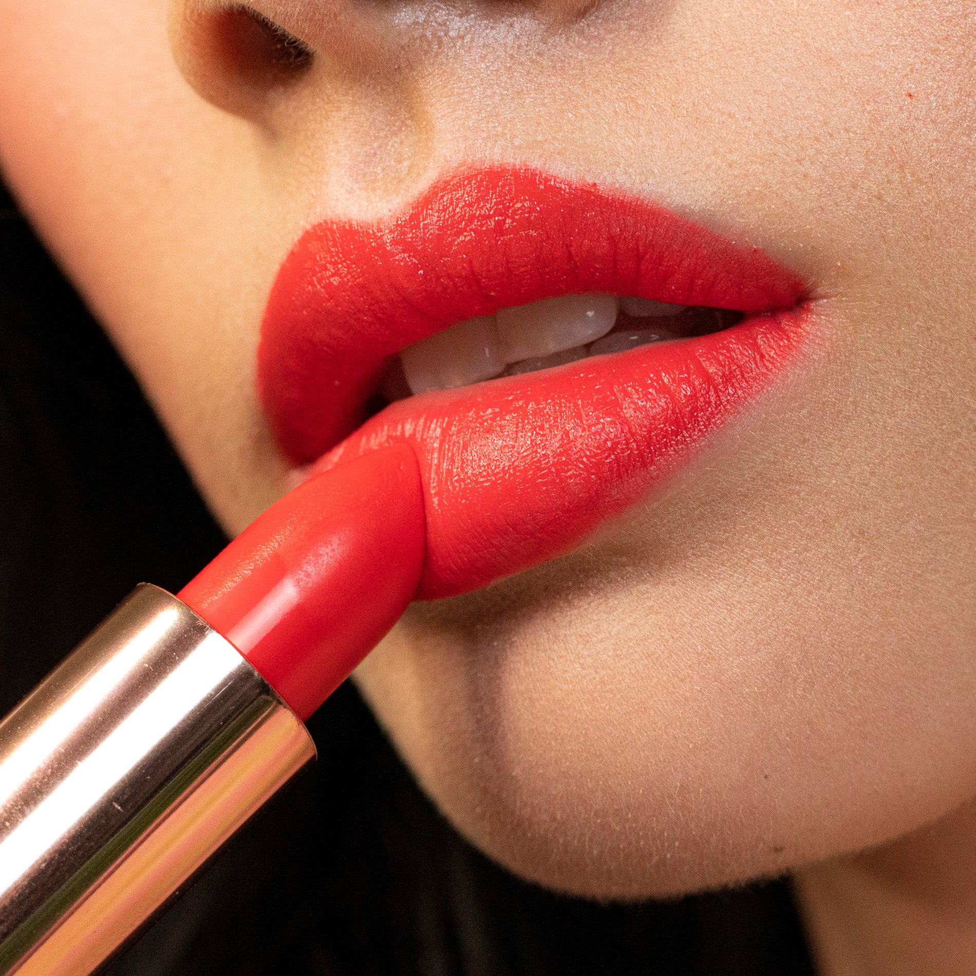 Model applying 12 Rymba Rhythm - Natural Lipstick