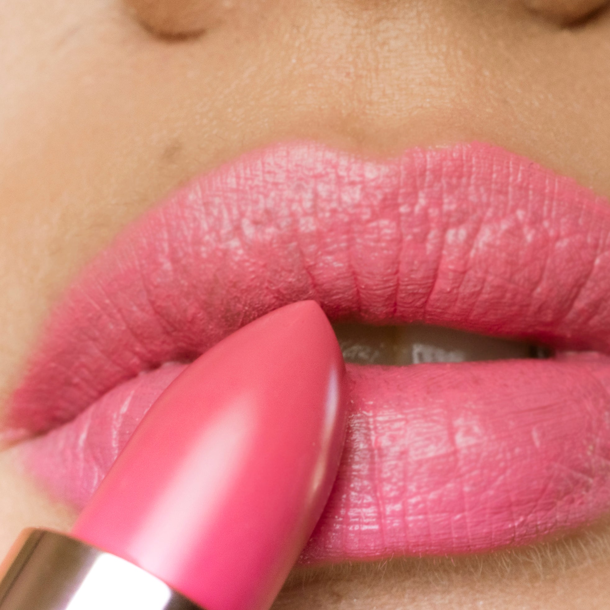 applying Camellia Morning - Natural Lipstick on lips 