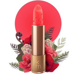 A gold-colored lipstick tube with a floral pattern on the lid, the color of the lipstick is described as a bright and bold fuchsia with red undertones, reminiscent of a passion flower.