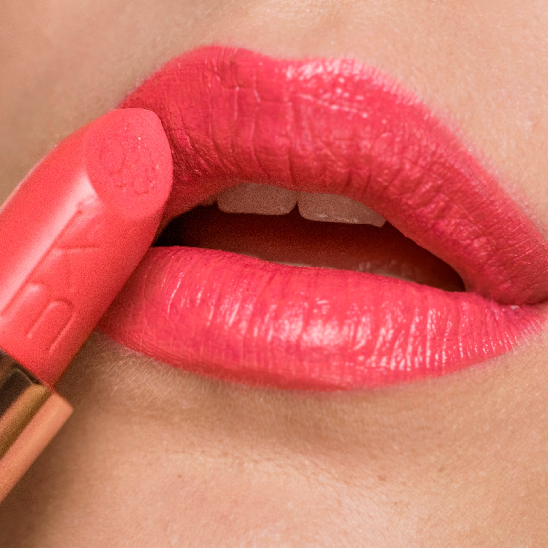 lips with bright coral lipstick