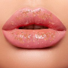 lip scrub on lips showing sugar particles