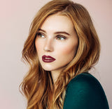 Model wearing #22 Bordeaux Rouge moisturising lipstick